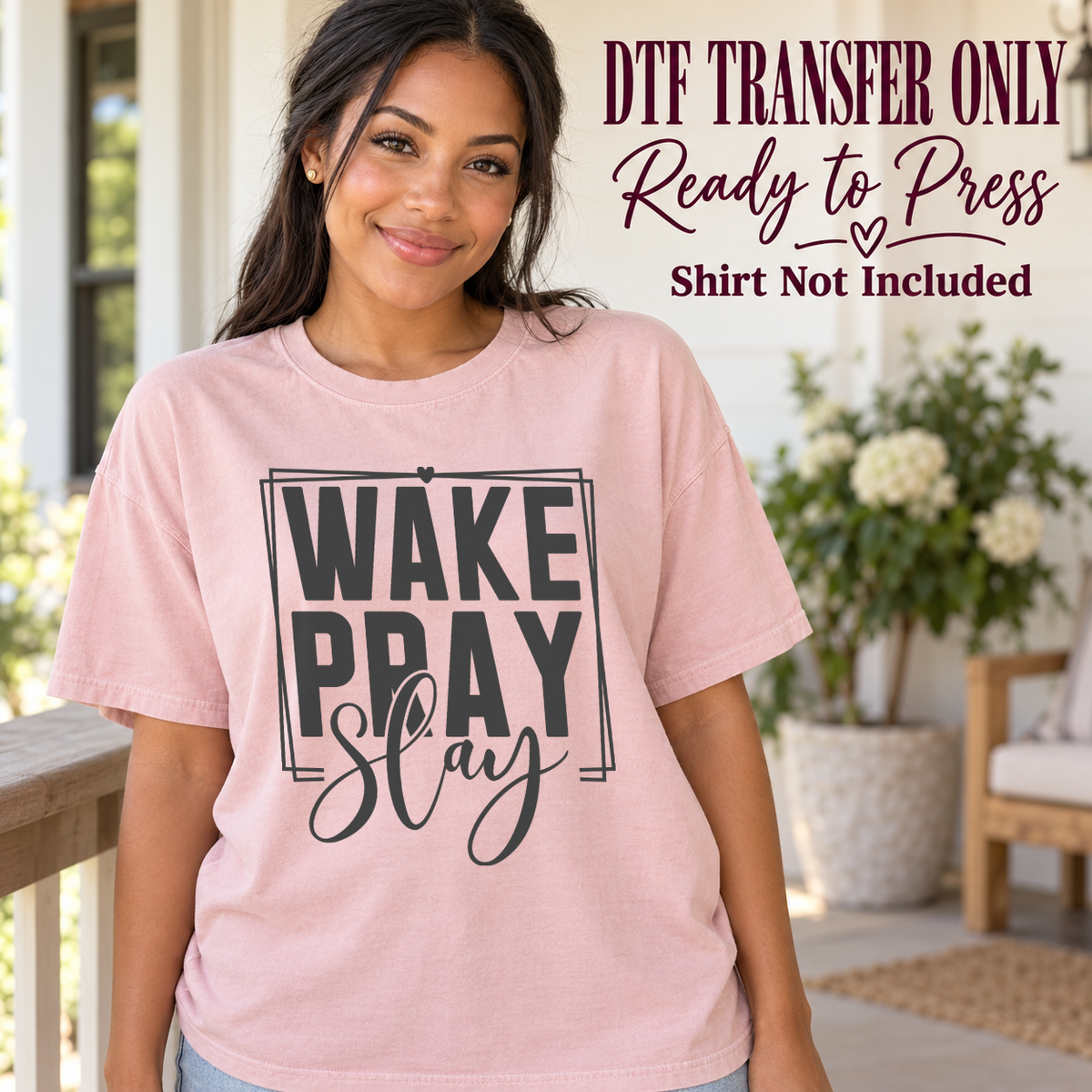 Wake Pray Slay black typography shown on a pink shirt worn by a woman; DTF transfer only, shirt not included.