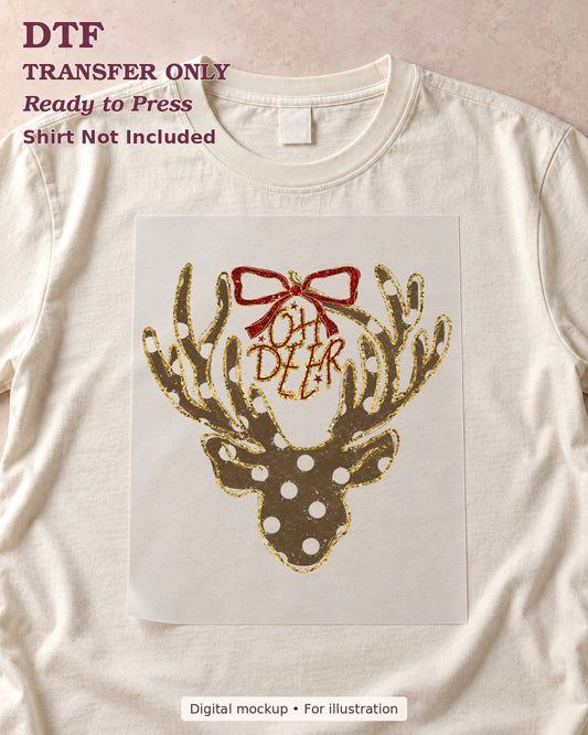 Oh Deer lettering inside antlers of dotted deer silhouette with red bow, shown as a transfer sheet on a cream shirt; shirt not included.