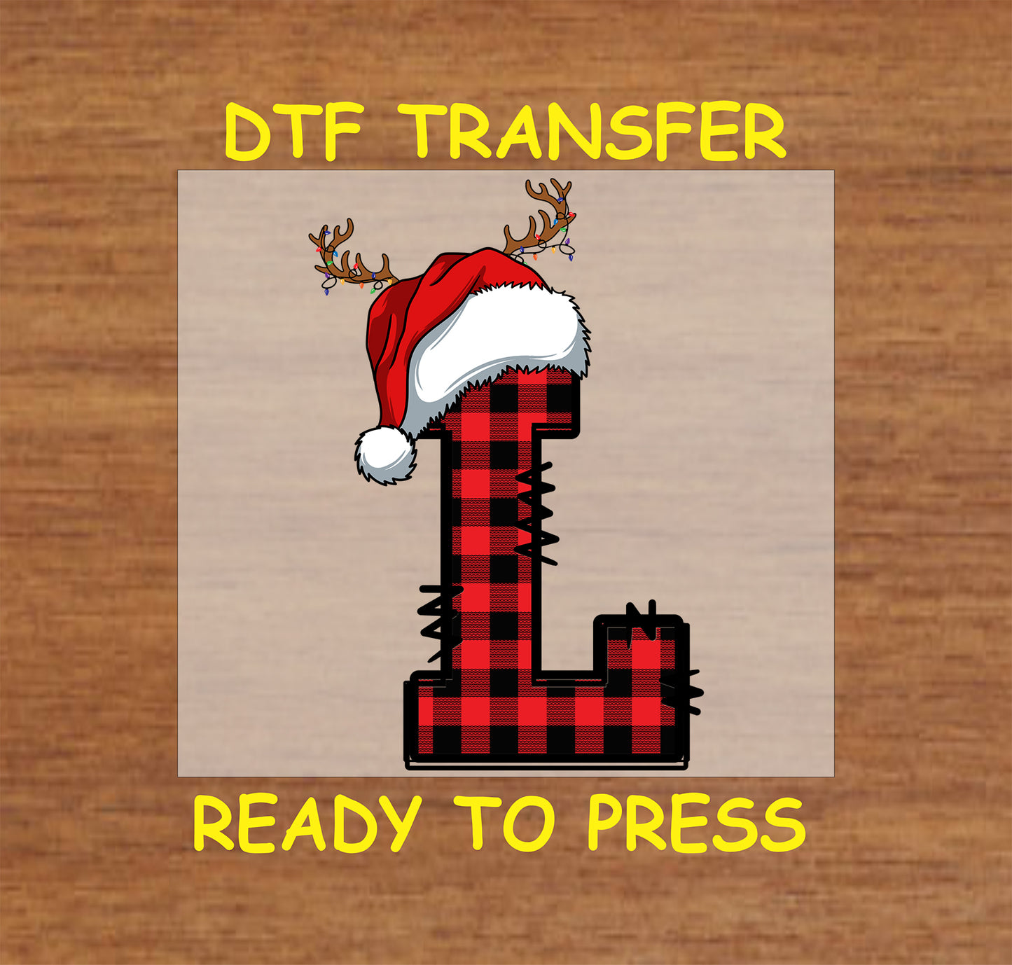 DTF transfer featuring a buffalo plaid letter "L" adorned with a Santa hat and reindeer antlers, perfect for festive holiday apparel and Christmas crafting.
