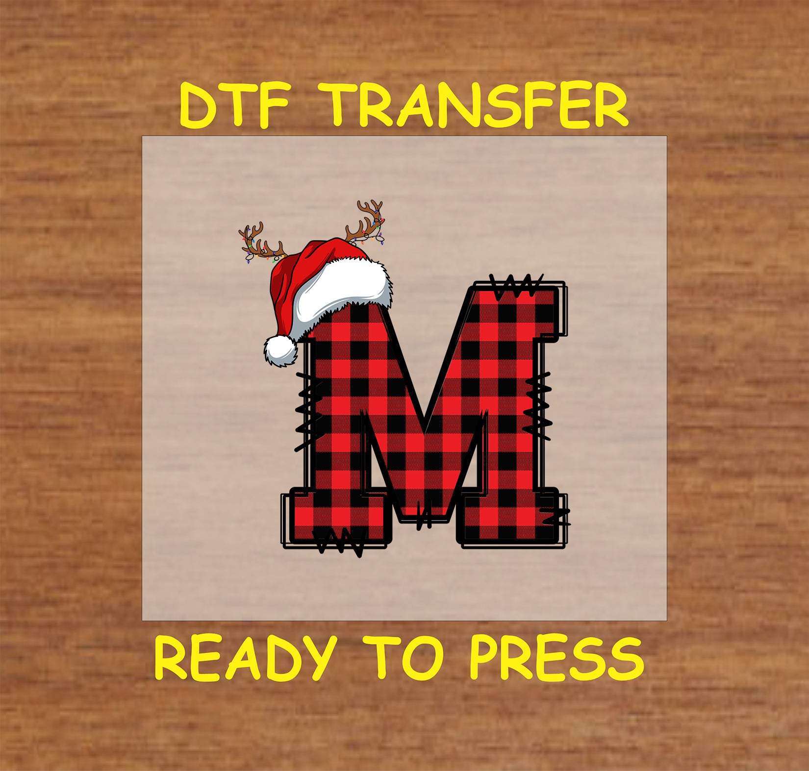 DTF transfer featuring a buffalo plaid letter "M" adorned with a Santa hat and reindeer antlers, perfect for festive holiday apparel and Christmas crafting.