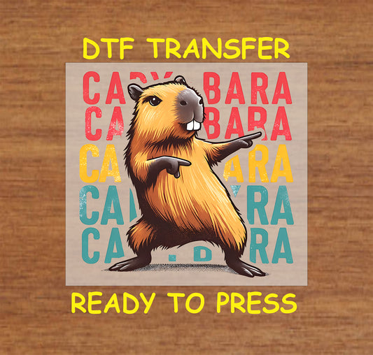 Colorful capybara DTF transfer with a funky pose and bold text for custom apparel.