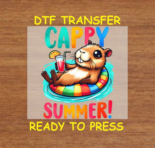Bright and fun capybara DTF transfer design with "Cappy Summer" text, featuring a capybara on a rainbow floatie and holding a drink.