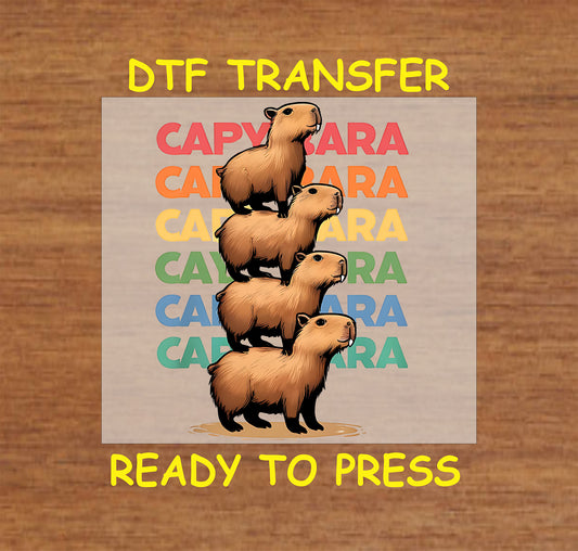 Stack of capybaras DTF transfer showing four adorable capybaras stacked on each other with colorful text in the background.