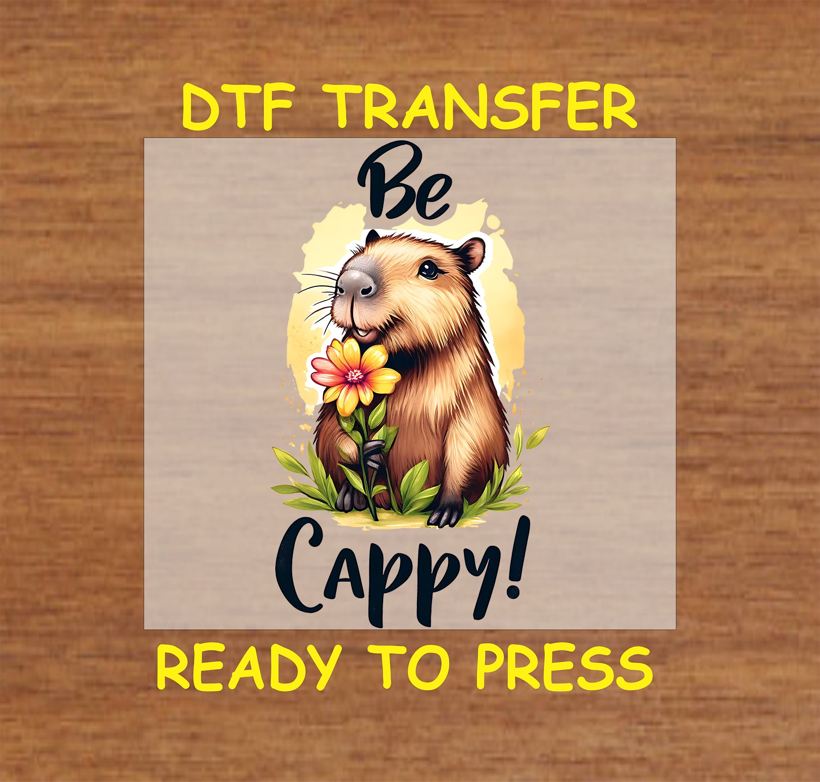 "Be Cappy" DTF transfer with a cheerful capybara holding a flower and yellow background.