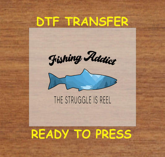 "Fishing Addict - The Struggle is Reel" DTF transfer design for crafting fishing-themed t-shirts.
