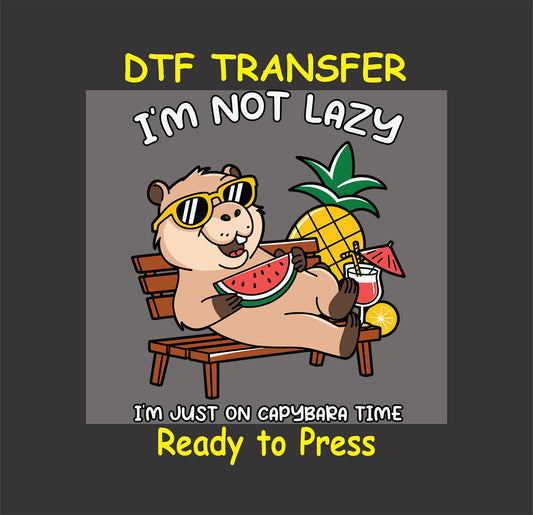 "Chilled-out capybara enjoying watermelon, pineapple, and drinks with the text 'I'm Not Lazy, I'm Just on Capybara Time' – a fun DTF transfer design for custom apparel."