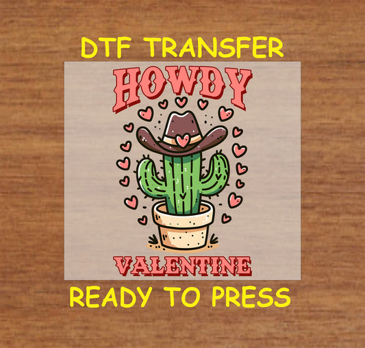 Howdy Valentine DTF Transfer featuring a potted cactus wearing a cowboy hat surrounded by hearts, perfect for Western-themed Valentine’s Day apparel.
