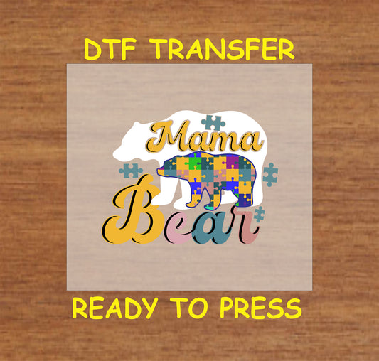 "DTF transfer featuring a mama bear and baby bear with colorful puzzle pieces and the words 'Mama Bear' in bold, playful fonts."