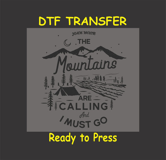 "DTF transfer with mountains, a tent by a river, and the quote 'The Mountains Are Calling and I Must Go,' ready to press for custom outdoor apparel."
