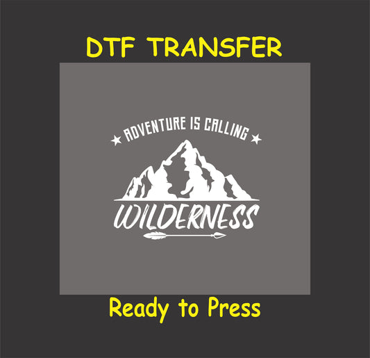 "Adventure is Calling Wilderness DTF transfer with mountain and arrow design, ready to press for outdoor-themed shirts."