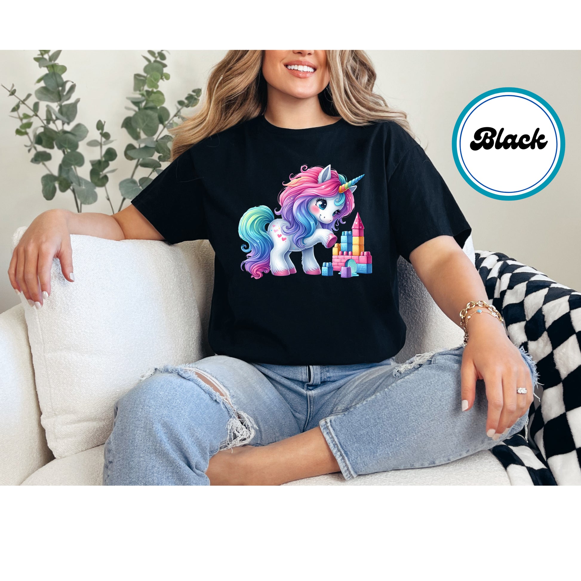 Cute rainbow unicorn with heart accents and a colorful castle DTF transfer.