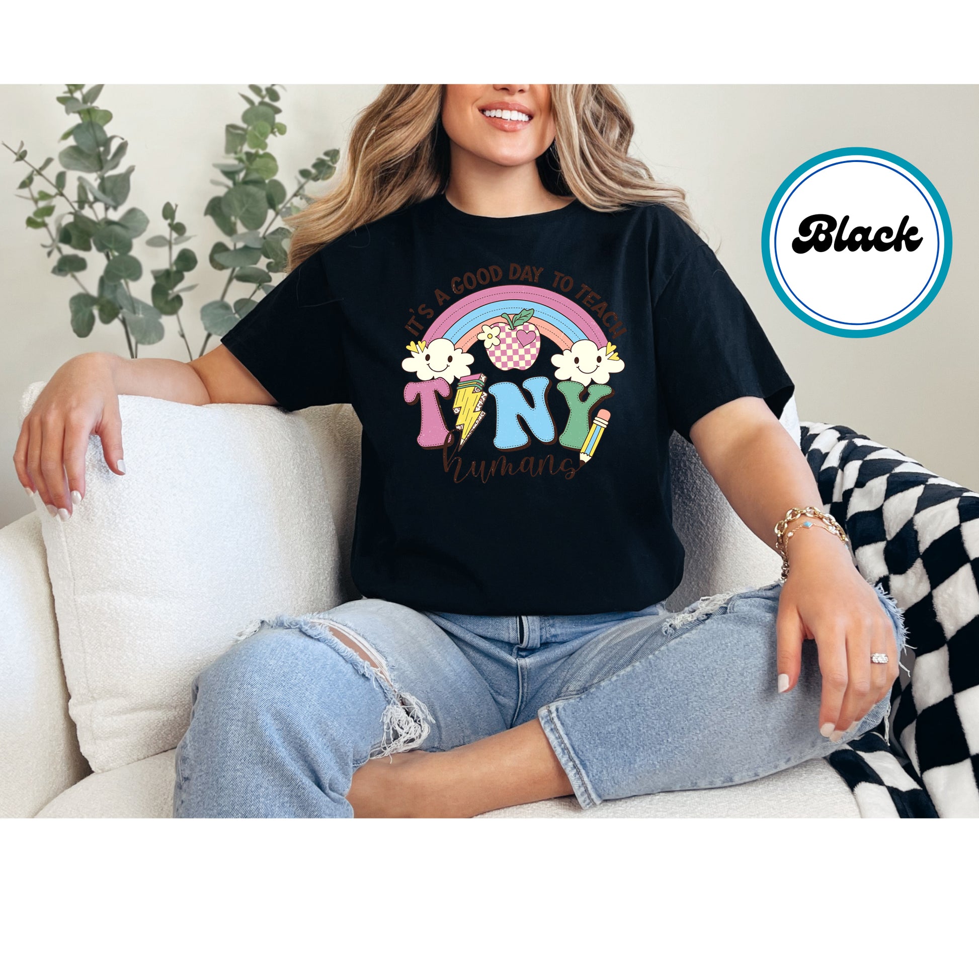 Teacher design with a rainbow, apple, clouds, and "Tiny Humans" text.