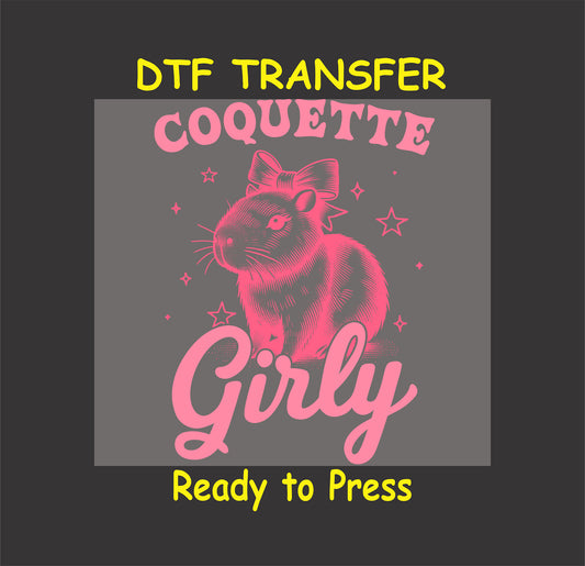 Capybara with a bow and "Coquette Girly" text in pink with sparkles.