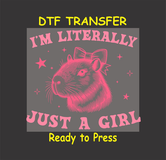 Capybara with a bow, surrounded by sparkles, with "I'm Literally Just a Girl" text in pink.