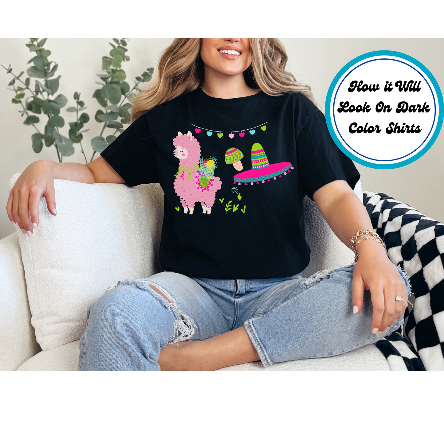 Pink llama with a fruit basket, sombrero, maracas, and a festive heart garland.