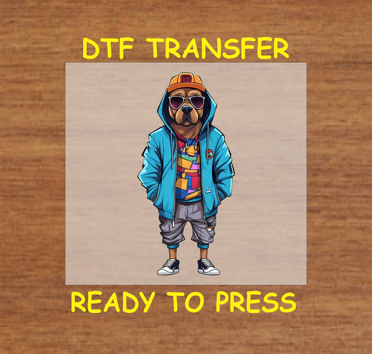 Dog in a blue hoodie, geometric shirt, gray shorts, and sunglasses with a streetwear look.
