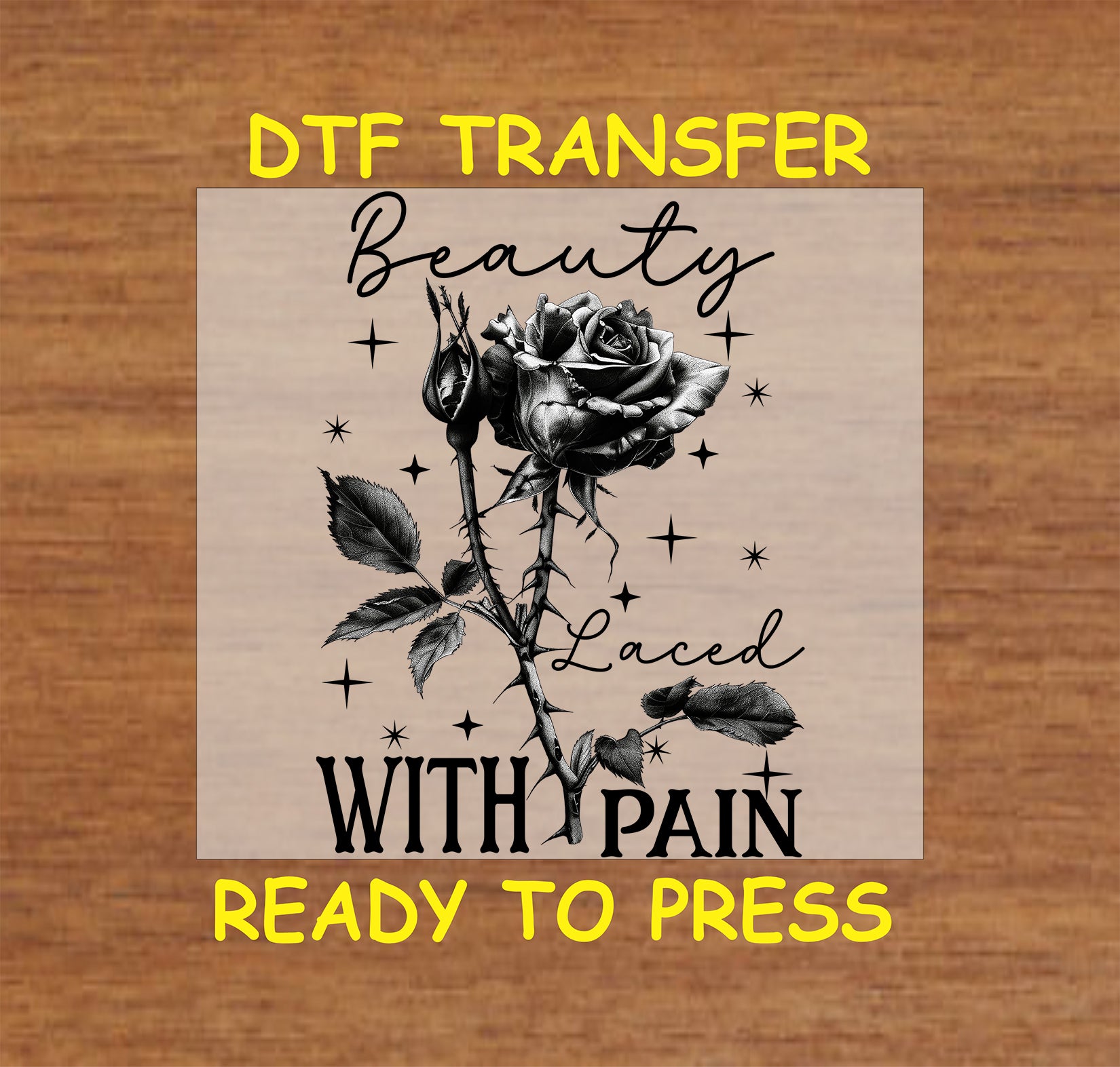 Black and white thorned rose with "Beauty Laced with Pain" gothic text, DTF transfer.