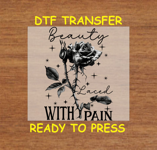 Black and white thorned rose with "Beauty Laced with Pain" gothic text, DTF transfer.