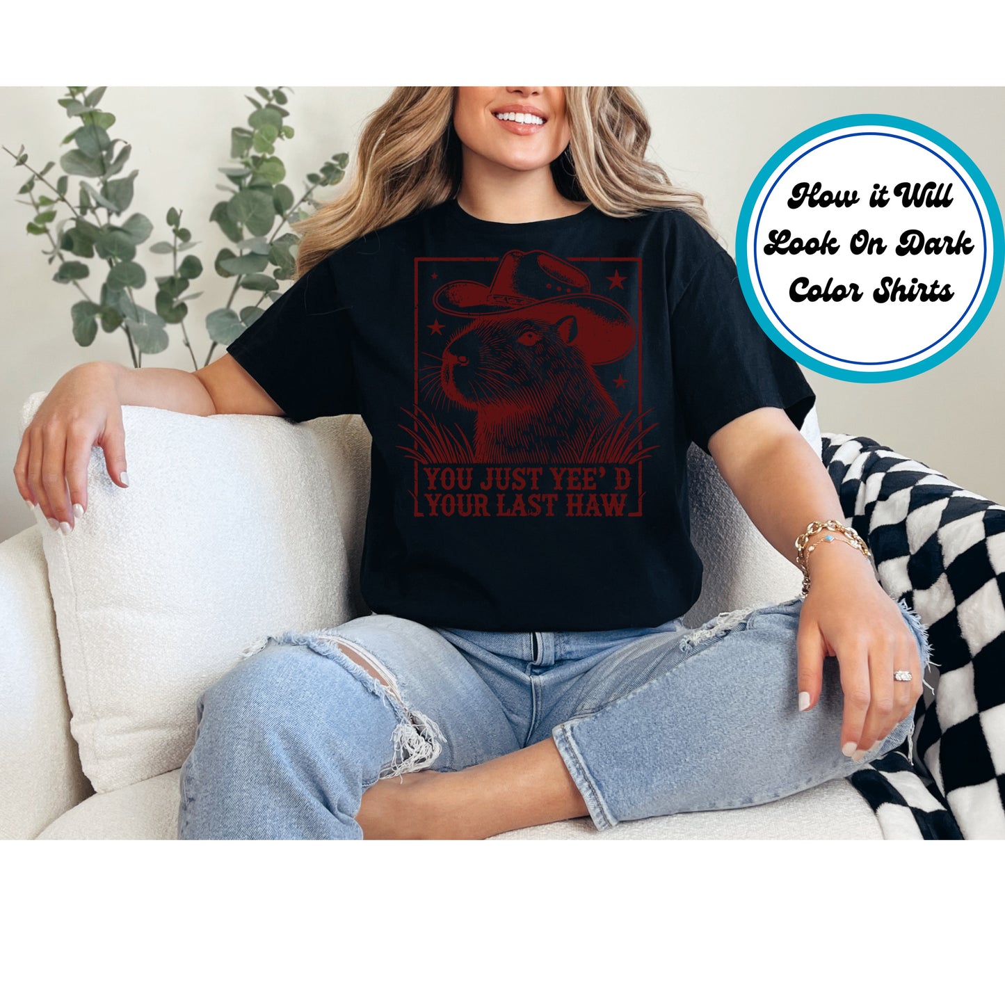 Capybara wearing a cowboy hat with the phrase "You Just Yee’d Your Last Haw" in a vintage western style.