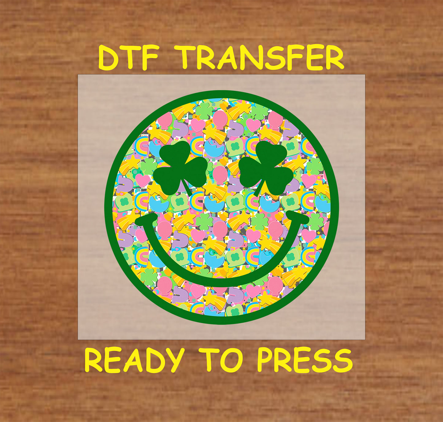 St. Patrick’s Day kids DTF transfer with a clover-eyed smiley face filled with colorful shamrocks, rainbows, hearts, and stars.