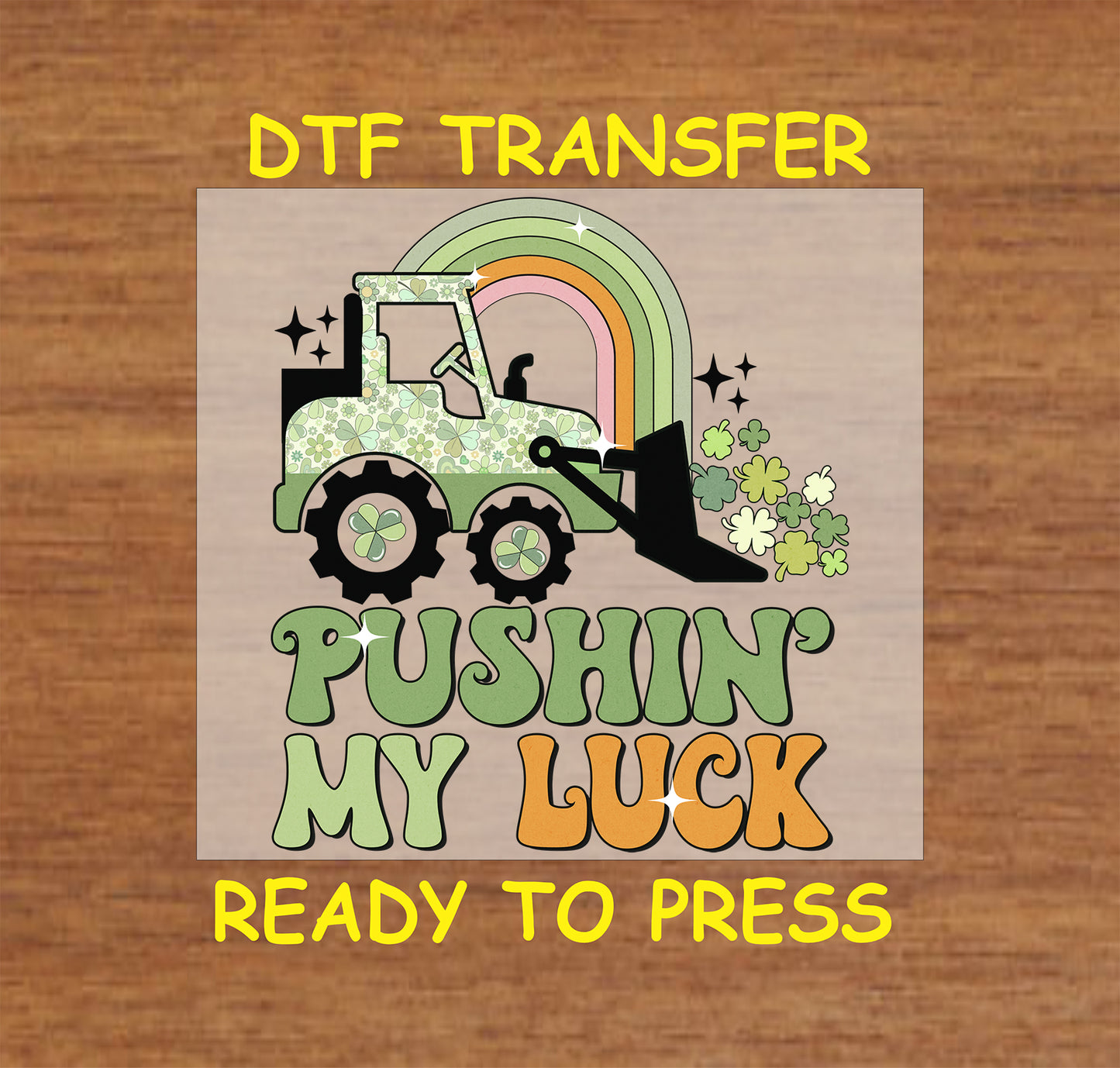 St. Patrick’s Day DTF transfer featuring a construction vehicle pushing shamrocks under a rainbow with “Pushin’ My Luck” text.