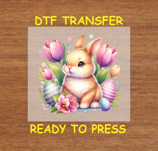 Cute Easter bunny with tulips and colorful decorated eggs.