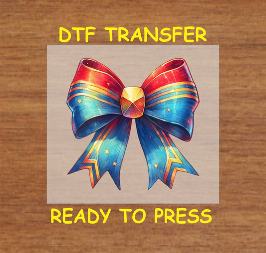 Patriotic fireworks bow DTF transfer for 4th of July with red, white, and blue colors, and a gemmed center.