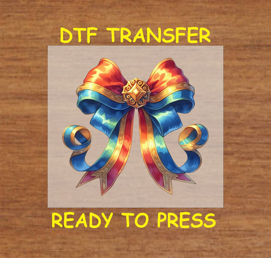 Fourth of July patriotic bow DTF transfer featuring colorful ribbons, golden embellishments, and star details in red, white, and blue.