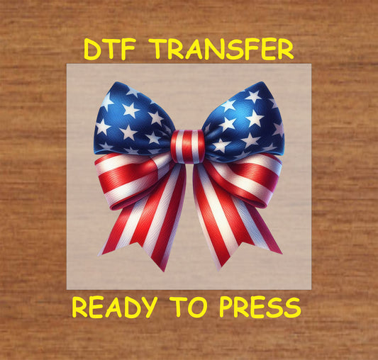Patriotic bow with red, white, and blue ribbons and stars for a Fourth of July transfer.