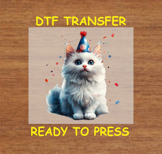 White cat with a patriotic party hat and confetti DTF transfer for 4th of July.