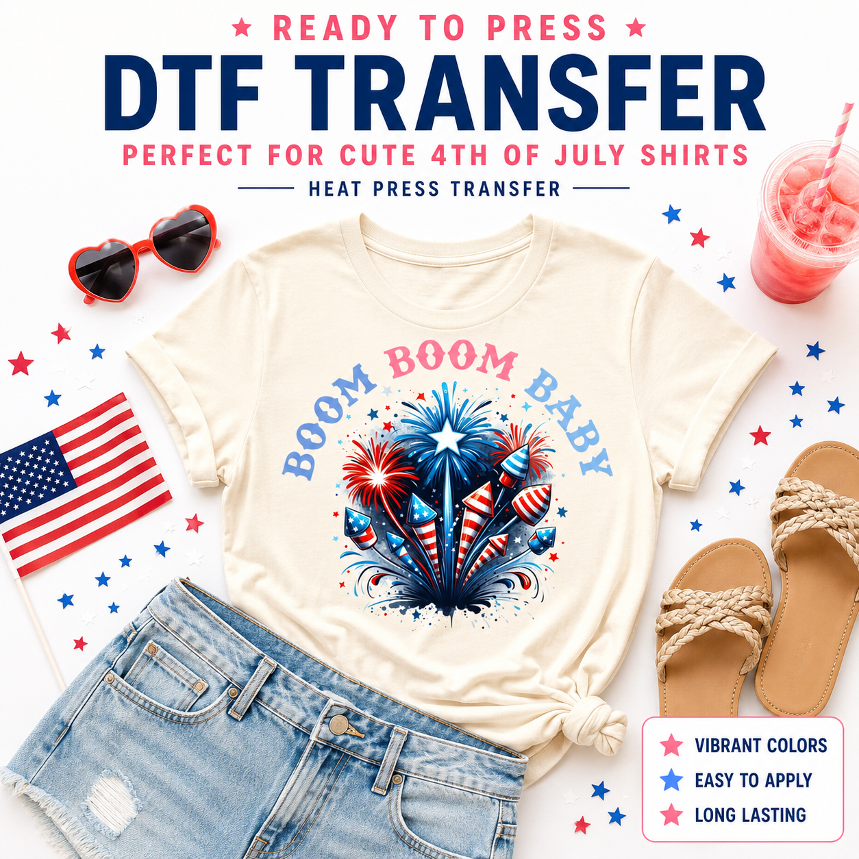 Ready to press DTF transfer mockup featuring a cute Boom Boom Baby fireworks design on a cream shirt with rockets, denim shorts, sandals, American flag, heart sunglasses, pink drink, and 4th of July props.
