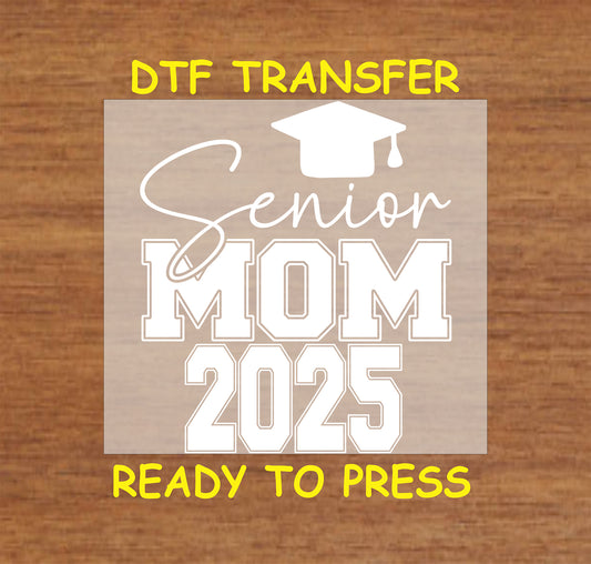 Senior Mom 2025 DTF transfer with varsity-style text and a graduation cap.