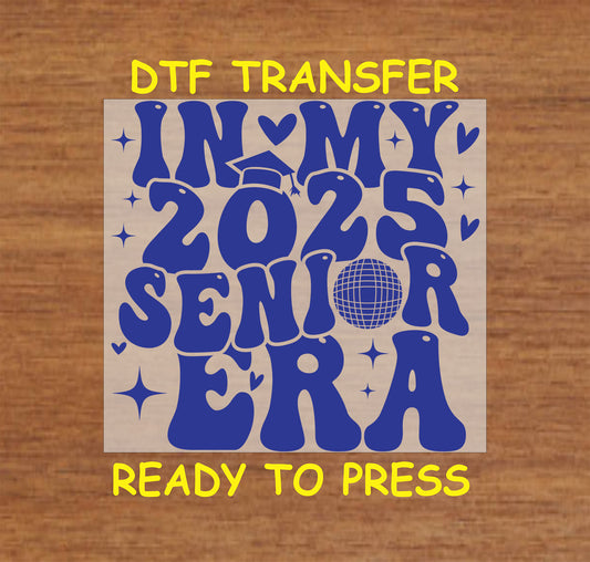 In My 2025 Senior Era DTF transfer with bold blue retro text, hearts, a disco ball, and graduation caps.