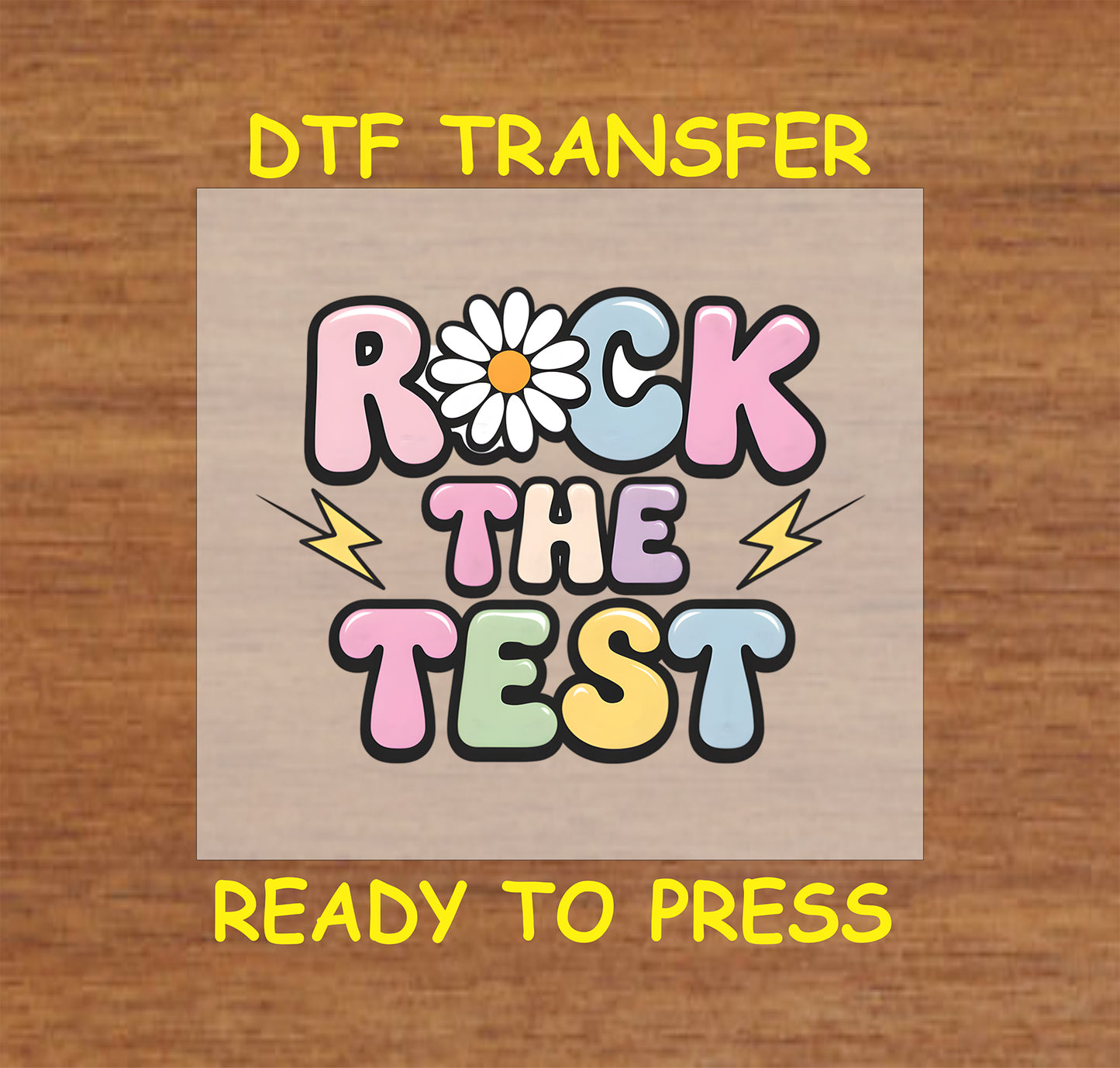 Rock the Test DTF transfer with colorful guitars and bold lettering.