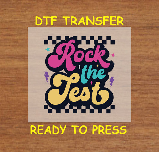 Rock the Test DTF transfer with retro checkered background and colorful text.