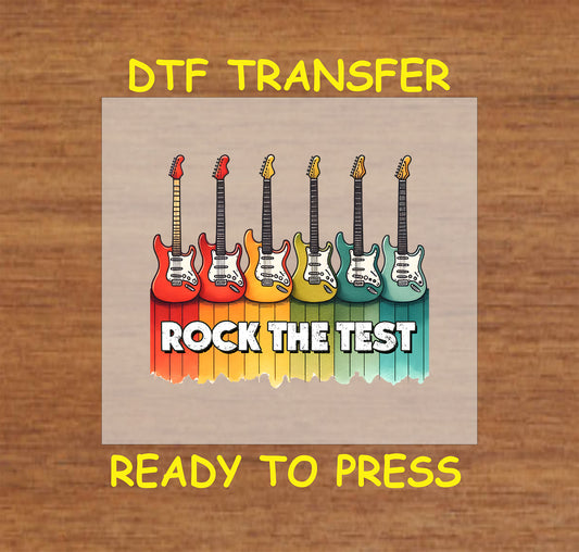 Rock the Test DTF transfer with colorful electric guitars and retro distressed background.