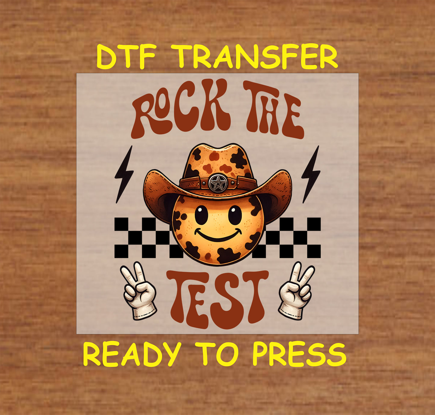 Rock the Test DTF transfer with cow print smiley, cowboy hat, peace signs, checkered pattern, and lightning bolts.
