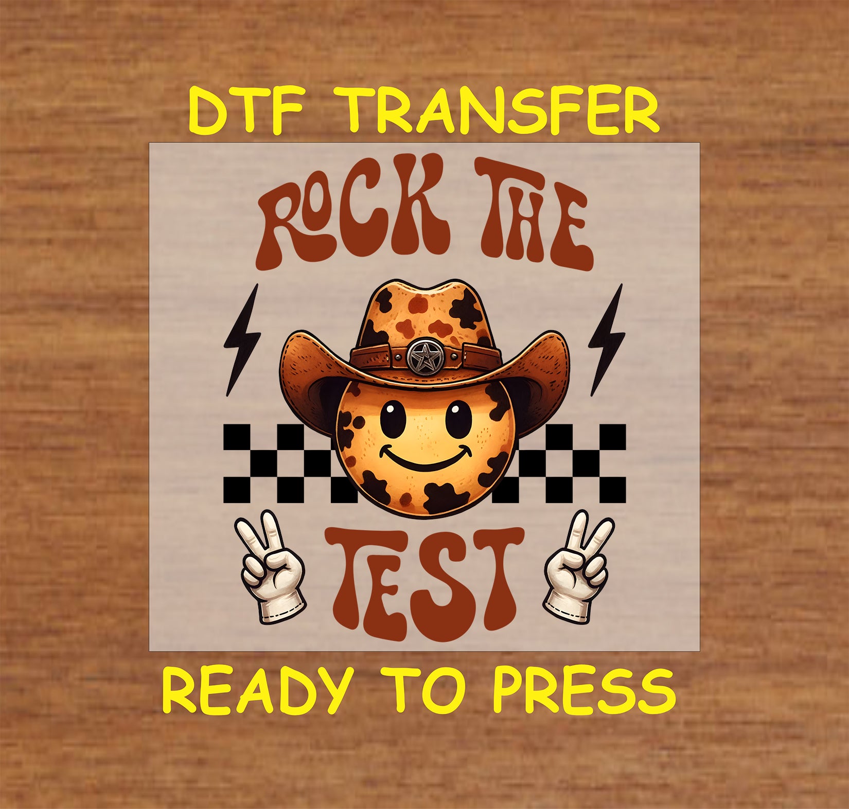 Rock the Test DTF transfer with cow print smiley, cowboy hat, peace signs, checkered pattern, and lightning bolts.
