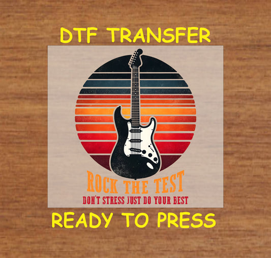 Rock the Test DTF transfer with a retro sunset and electric guitar.