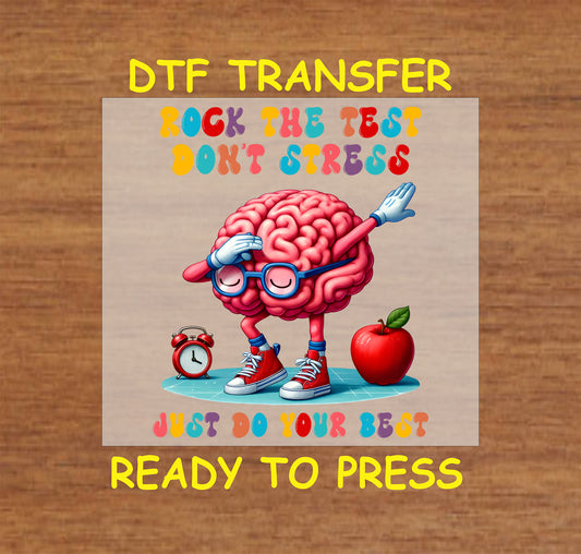 Rock the Test Brain DTF transfer with a cartoon brain dabbing, wearing glasses and sneakers, surrounded by school elements.