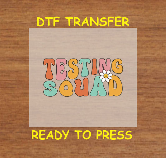 Retro "Testing Squad" DTF transfer with pastel colors and a daisy accent for school testing team spirit.