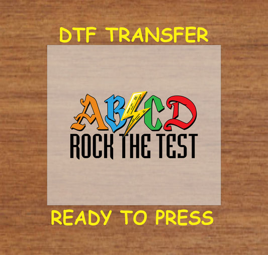 ABCD Rock the Test DTF transfer with colorful rock band-style letters.