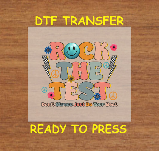 Rock the Test DTF transfer with a retro smiley, peace signs, lightning bolts, and floral accents.