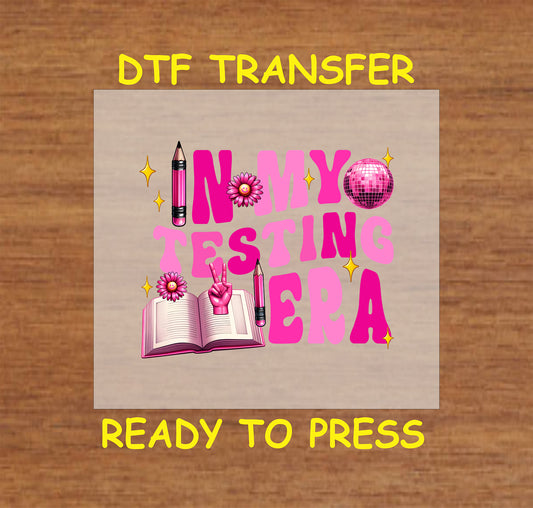 In My Testing Era DTF transfer with pink disco ball, pencils, book, and sparkles.