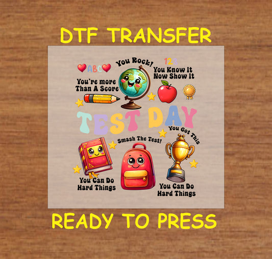 Test Day DTF transfer with cute school supplies, motivational phrases, and colorful text.