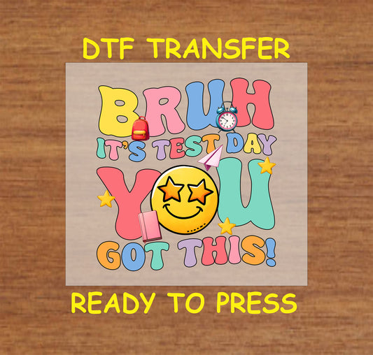 Bruh It’s Test Day You Got This DTF transfer with retro text, a star-eyed smiley face, and school icons.