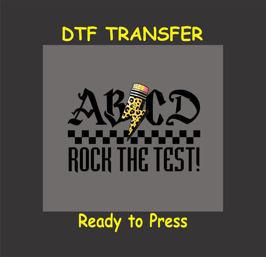 ABCD Rock the Test DTF transfer with gothic font, checkered pattern, and leopard-print pencil lightning bolt.