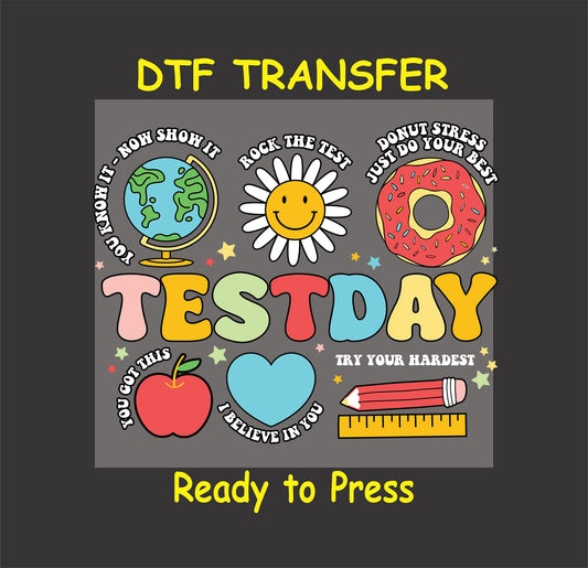 Test Day DTF transfer with colorful retro text, smiley face, donut, apple, and motivational phrases.