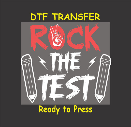 Rock the Test DTF transfer with bold red and white text, peace sign, pencils, and lightning bolts.