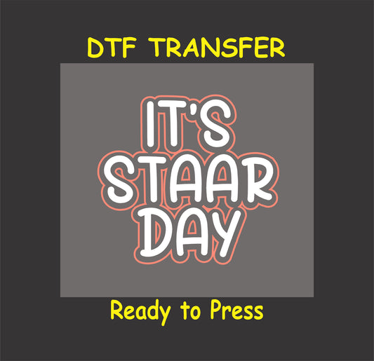 It’s STAAR Day DTF transfer with bold white text outlined in red, perfect for test day apparel.